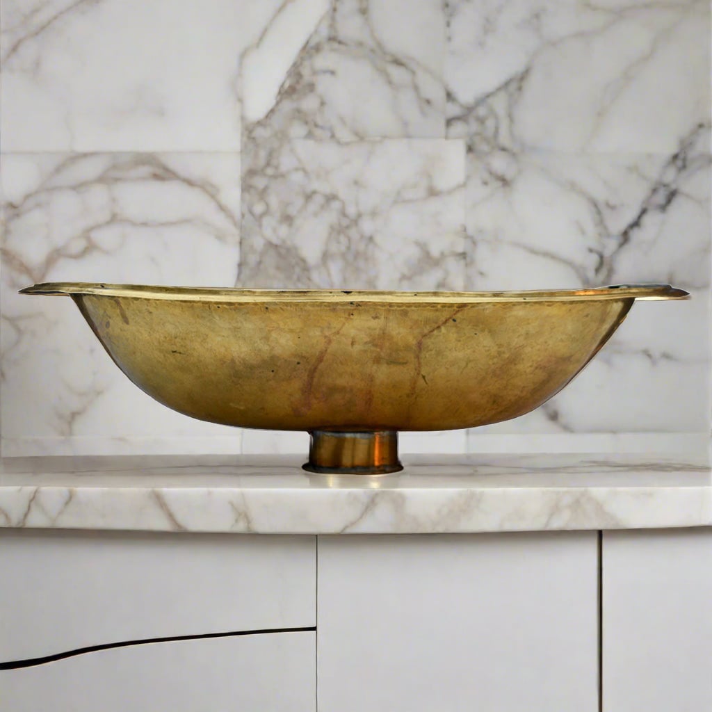 Bottom view of a Moroccan brass drop-in sink on a modern countertop 