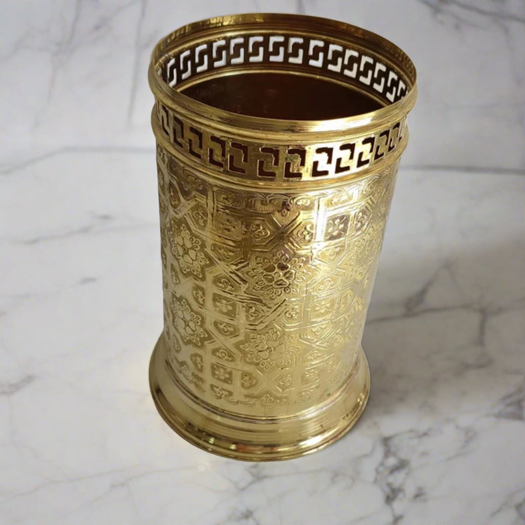 Engraved Brass Waste Basket with white marble background 