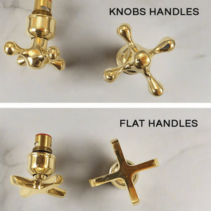 Faucet handles on a white marble background 
