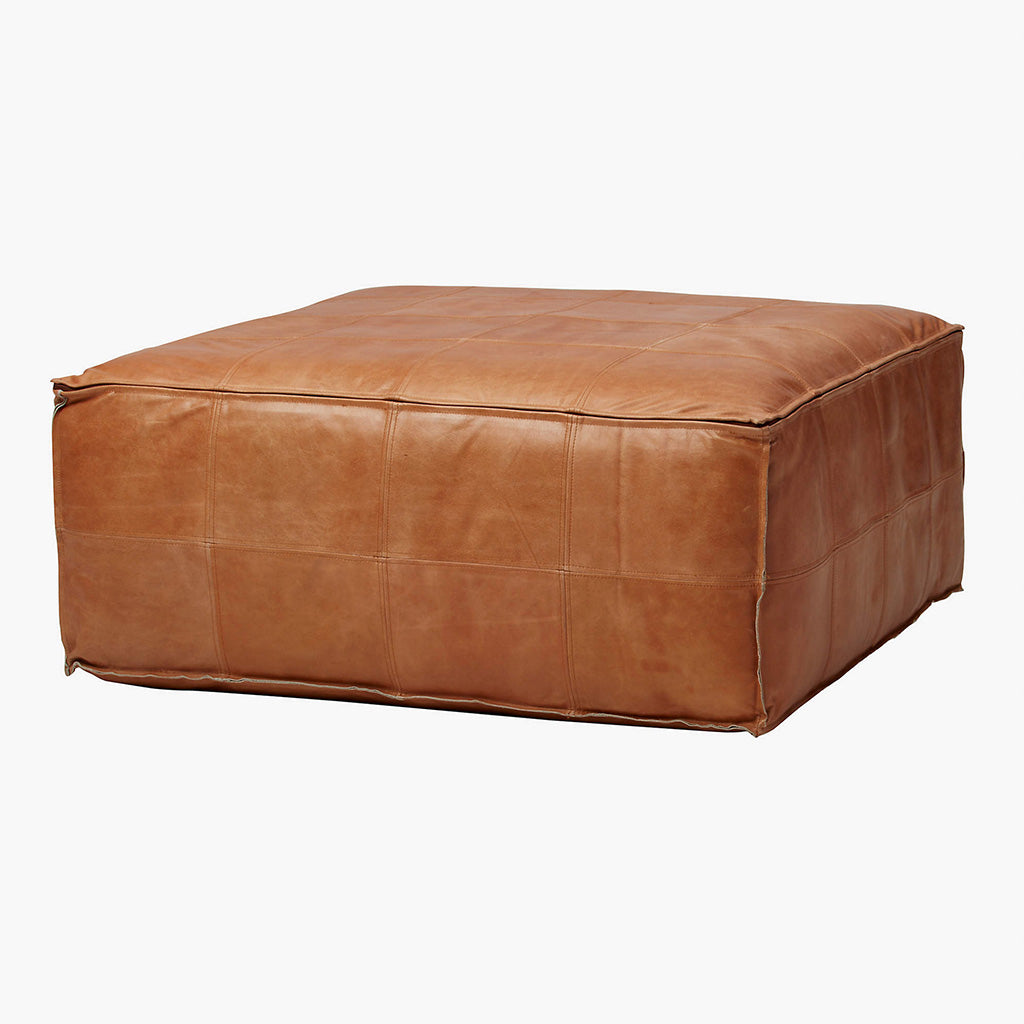 Side view of a Stitched leather pouf against white background - Moroccan Interior