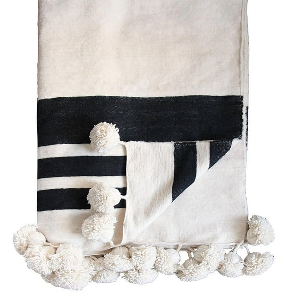 Moroccan Pompom Blanket in black and white against a white background - Moroccan Interior