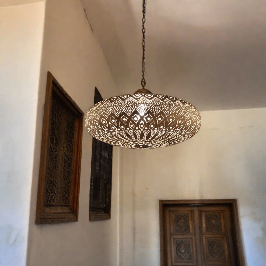 Moroccan brass lamp hanging from the ceiling in an old house room in Marrakesh 