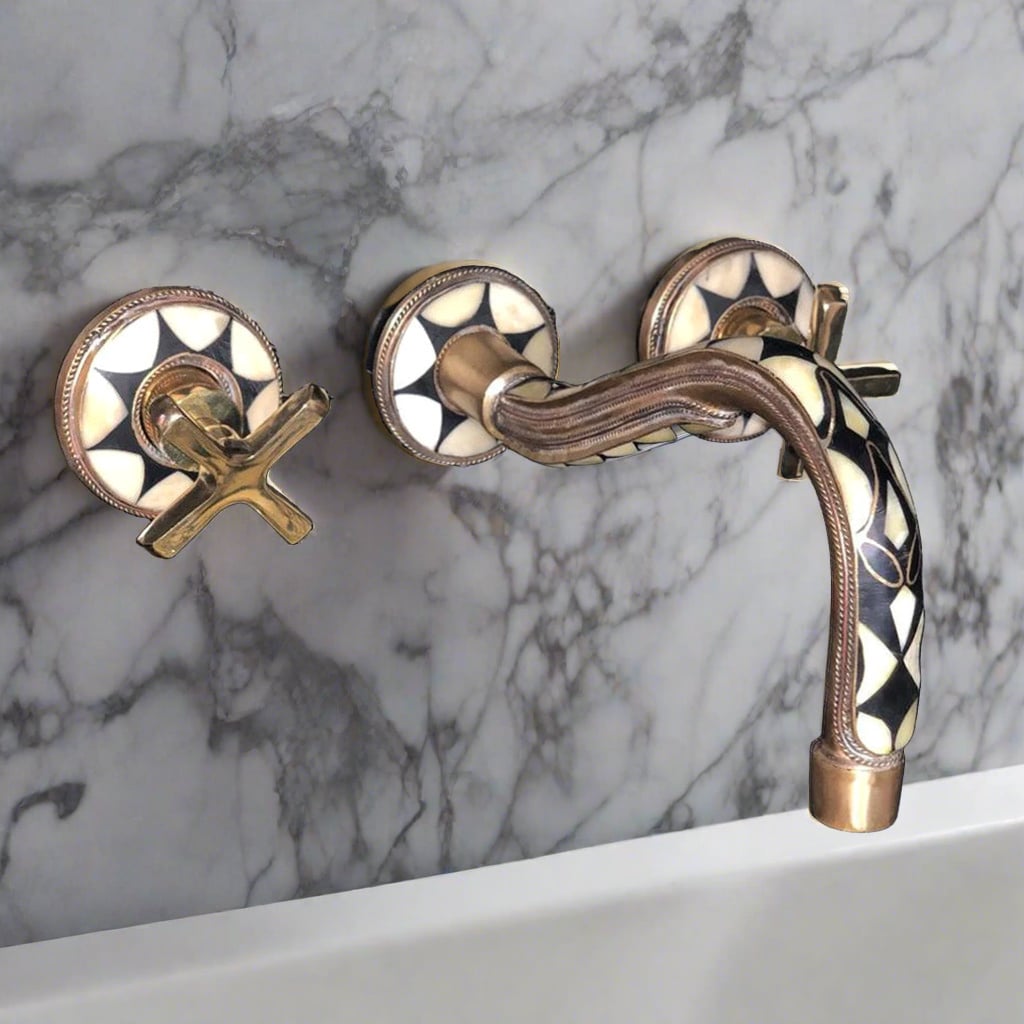 Unlacquered Brass Gooseneck Wall Mount Faucet installed in a bathroom 