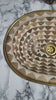 Video showing an oval undermount brass sink decorated with handmade pattern 