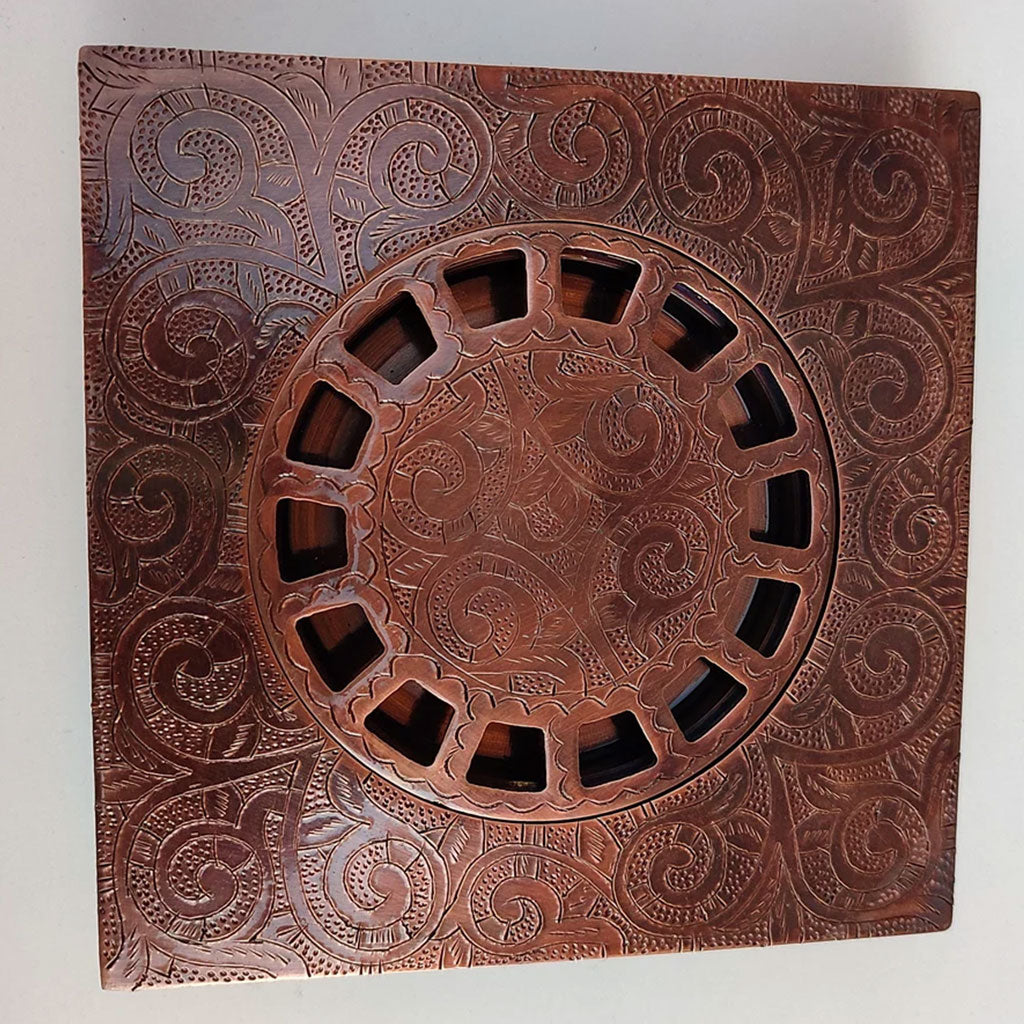 Engraved Copper Floor Drain with white background 