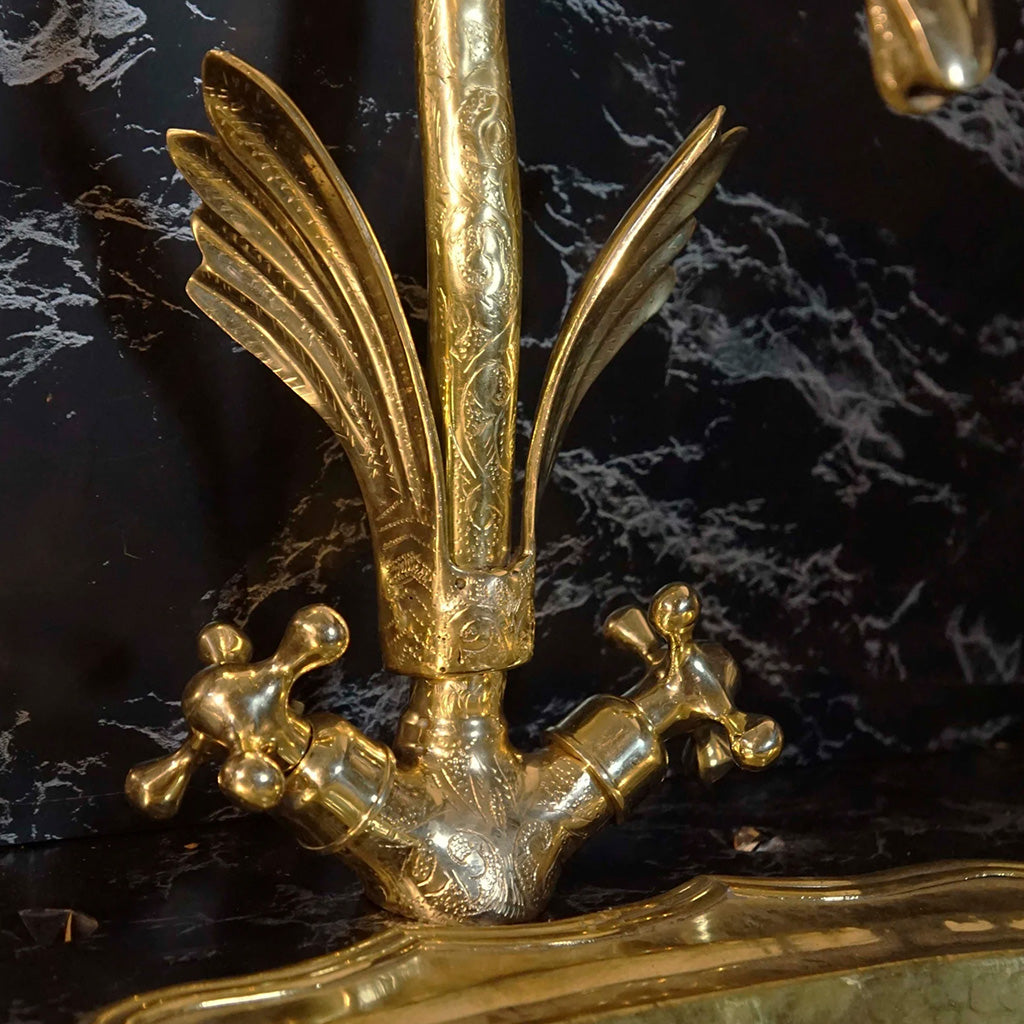 A gold swan shaped gooseneck brass faucet water flow handles 