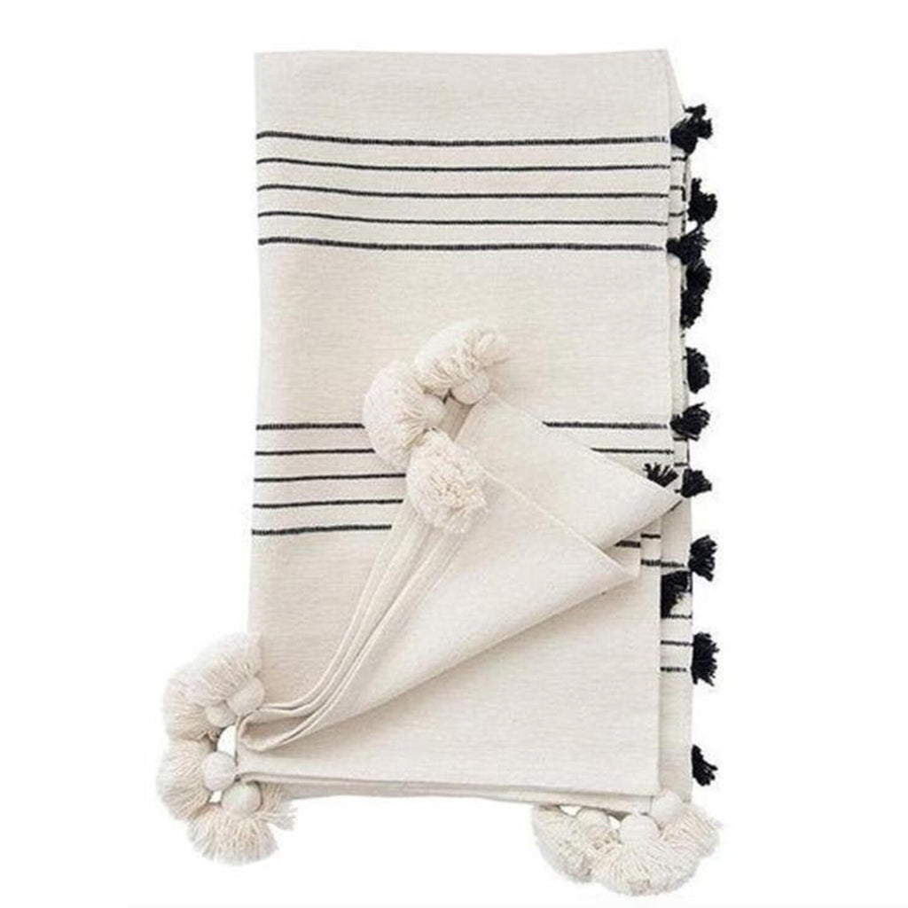 Moroccan Pompom Blanket in black and white against a white background - Moroccan Interior