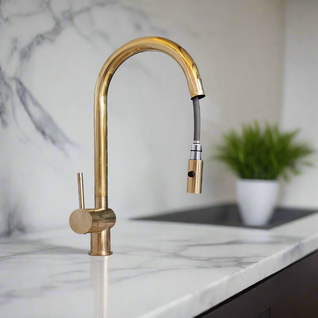 Brass kitchen faucet with pull-down spray nozzle extended, blending functionality with sleek, contemporary style