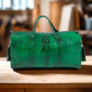 A front view of a premium green leather travel bag, featuring a sleek design, reinforced handles, and a classic buckle detail for added style and durability