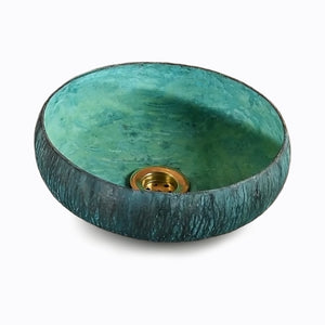 Handcrafted hammered copper vanity sink with turquoise patina finish and gold-toned drain in 