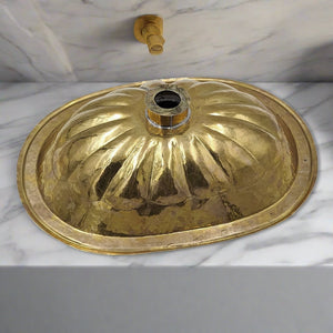 Underside view of Moroccan brass washbasin, showcasing the hand-finished brass craftsmanship and structural quality