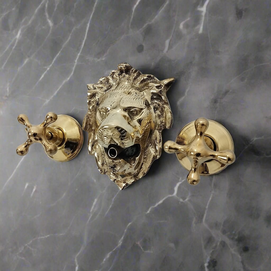 Brass lion head wall-mounted faucet with two cross handles on a dark marble surface