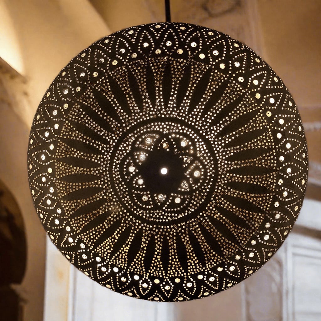 Side view of a Moroccan light fixture hanging from the ceiling, emphasizing its intricate design and the ambient lighting effect it creates