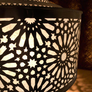 Close-up view of the handcrafted brass Moroccan pendant light, highlighting detailed geometric patterns and craftsmanship