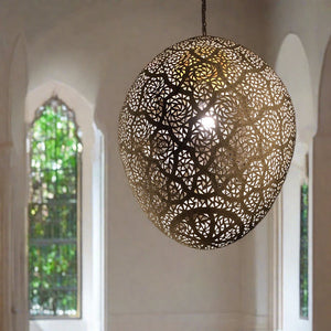 Moroccan decorative ceiling lamp casting light shadows in an old Marrakesh home - Moroccan interior.