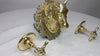 Video thumbnail of a brass wall-mounted faucet set with a sculpted horse head spout and two separate cross-handle knobs, displayed on a white textured surface