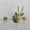 brass deer head wall-mounted faucet set with two cross handles on marble background, shown in close-up  video thumbnail view