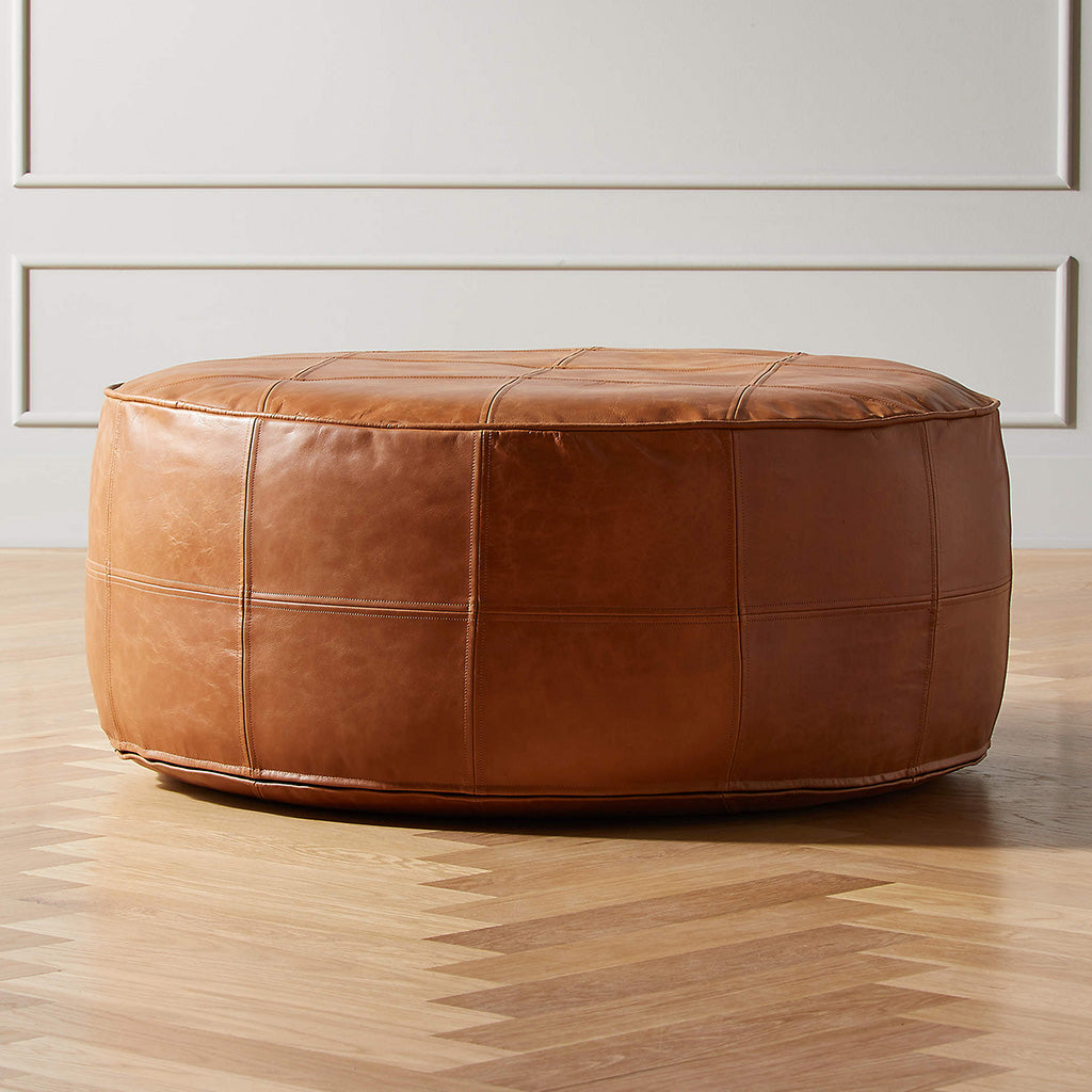 Round leather pouf on living space floor - Moroccan Interior