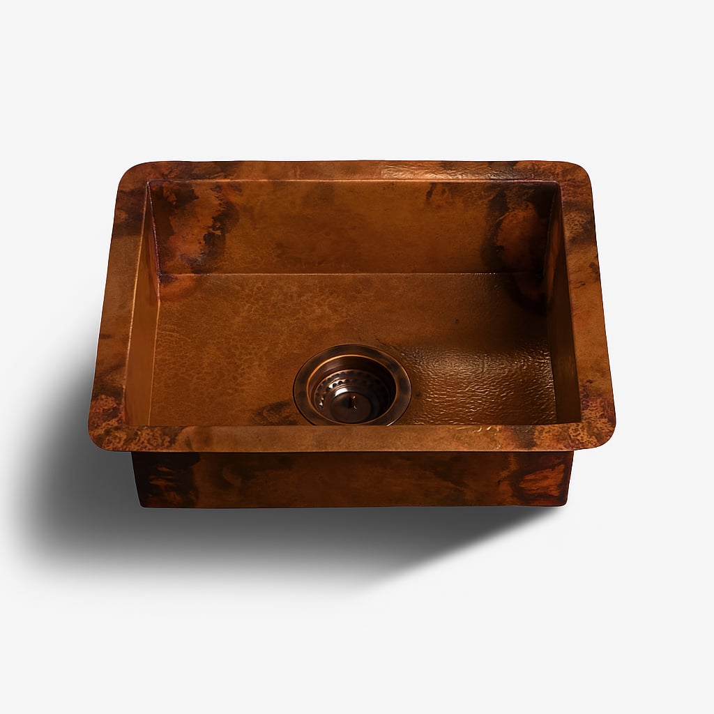 Copper kitchen sink with a hammered finish and center drain