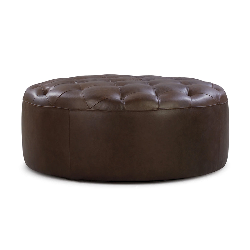 Front view of a tufted round leather pouf in dark brown color on a white background - Moroccan Interior.