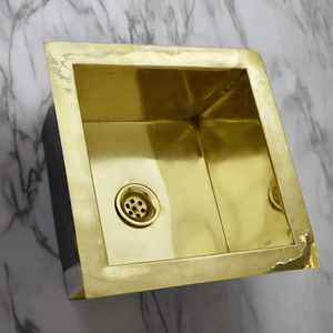 Front view of an ndermount Brass Kitchen Sink with white marble background - Moroccan Interior