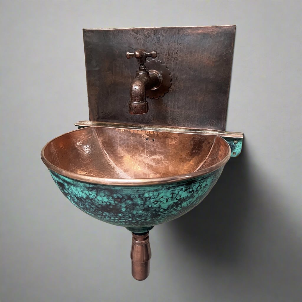 Handcrafted verdigris copper wall-hung sink with hammered finish and rustic faucet, ideal for vintage and modern bathroom interiors