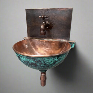 Handcrafted verdigris copper wall-hung sink with hammered finish and rustic faucet, ideal for vintage and modern bathroom interiors