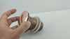 Video showing different views of a copper sink popup drain held by hands - Moroccan Interior