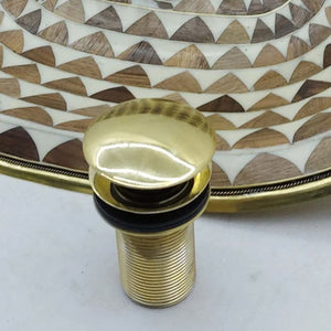 Popup Sink Drain and a brass sink behind - Moroccan Interior