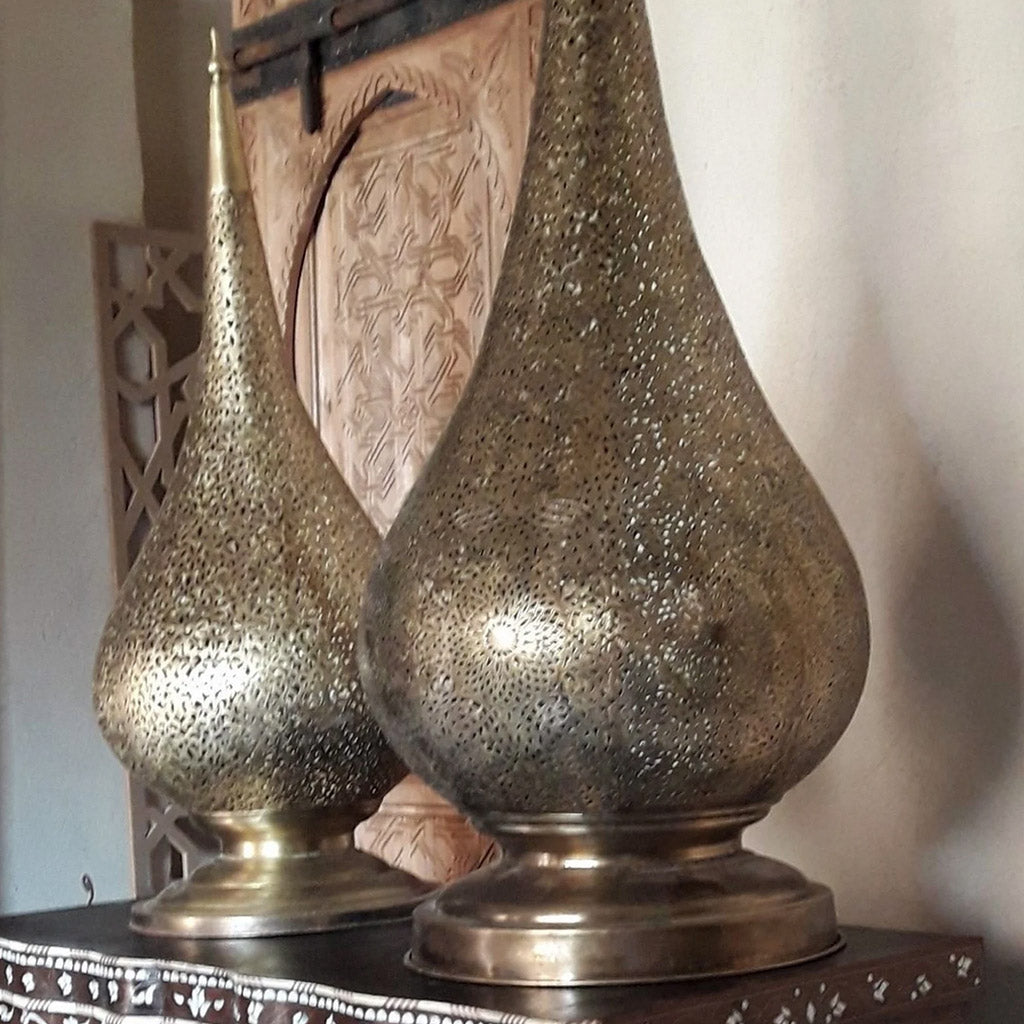 Set of two Moroccan Table Brass Lamp on a wood table in a room of an old riad in Marrakesh Morocco - Moroccan Interior