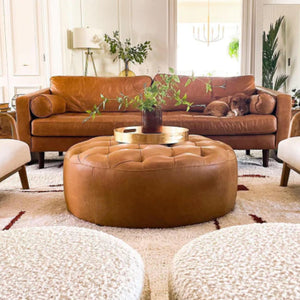 Scandinavian living room: Moroccan wool rug, 3-seat leather sofas, armchairs, stunning tufted leather pouf with tray - Moroccan Interior